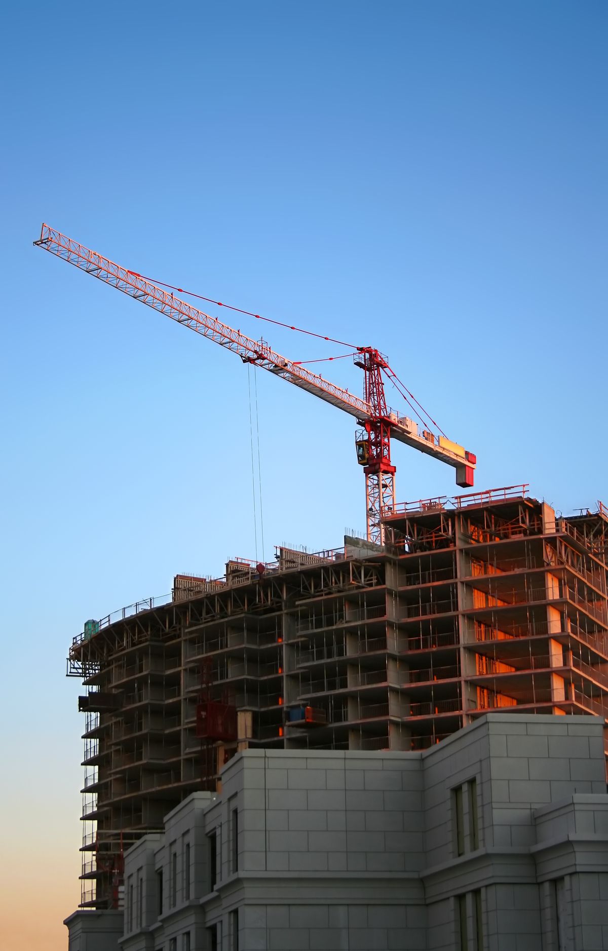 Tower crane on a construction site against the skyline