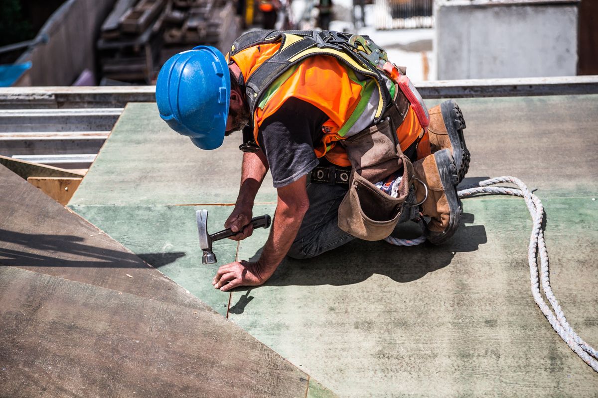 Construction worker in a high-visibility vest coordinating on site